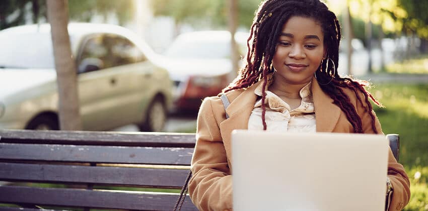 woman on computer, writing a cover letter